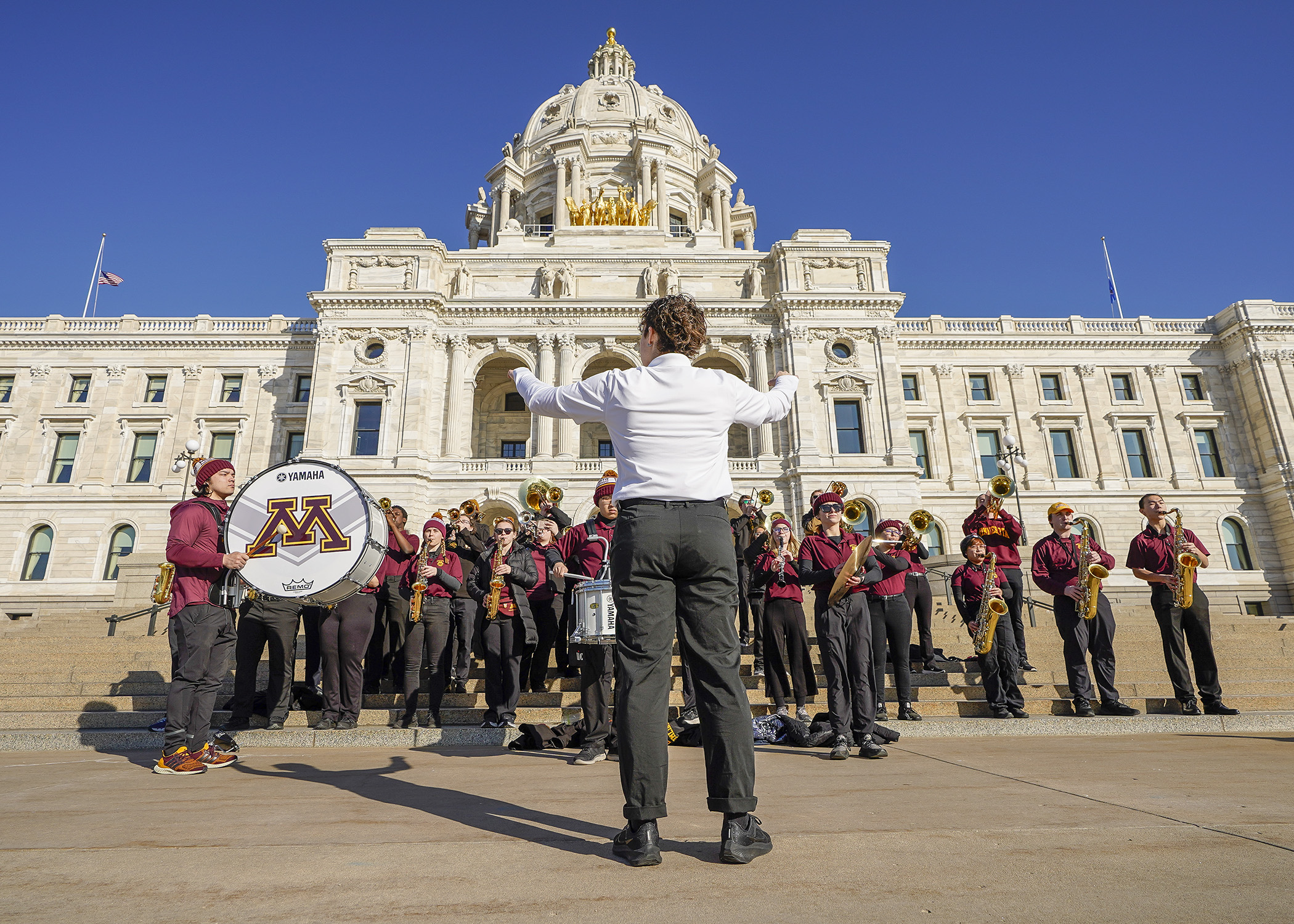 Drum Major Ari Martin conducts a University of Minnesota pep band Feb. 22 during U of M Day at the Capitol. (Photo by Andrew VonBank)